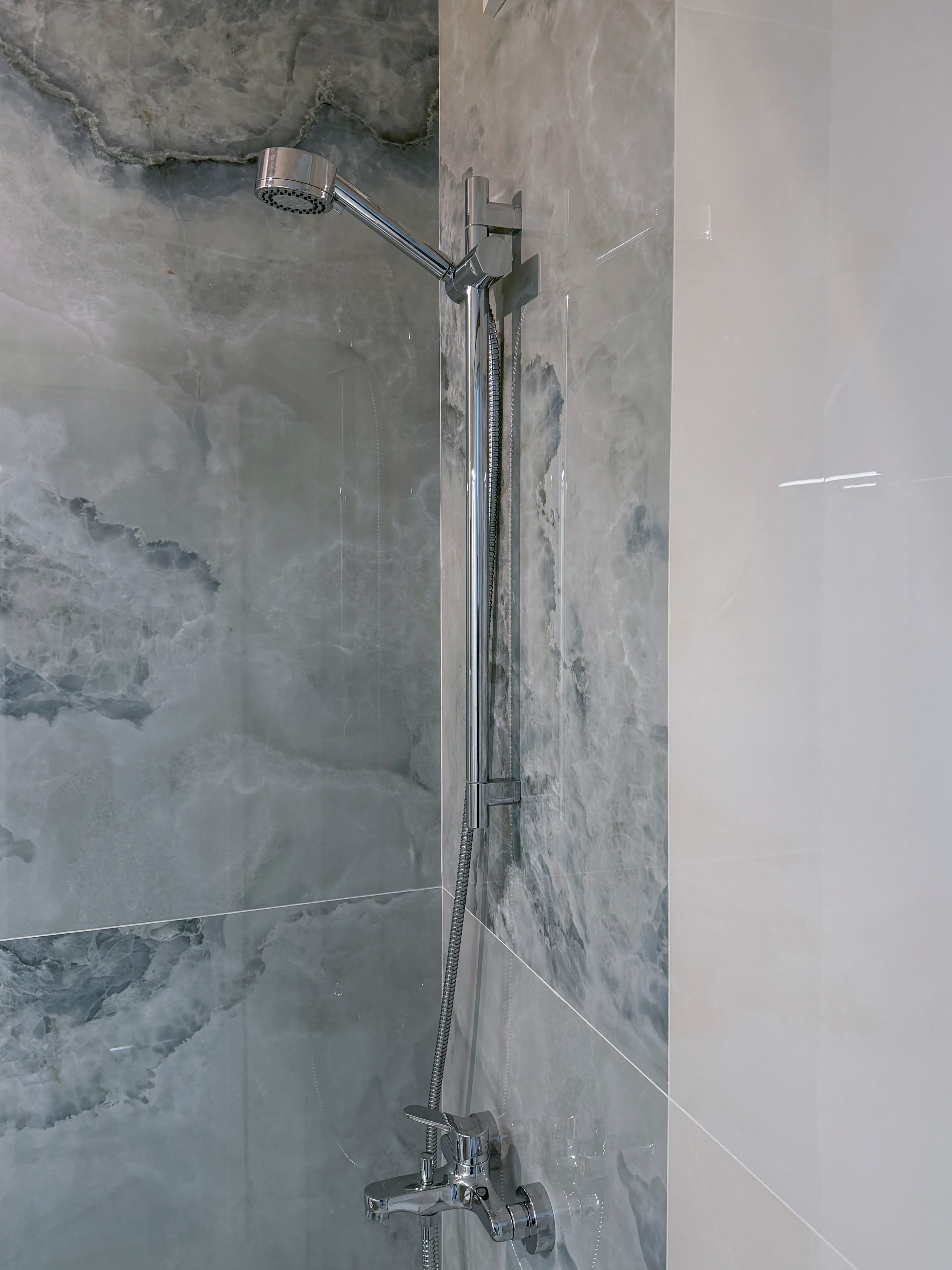 a shower head in a bathroom
