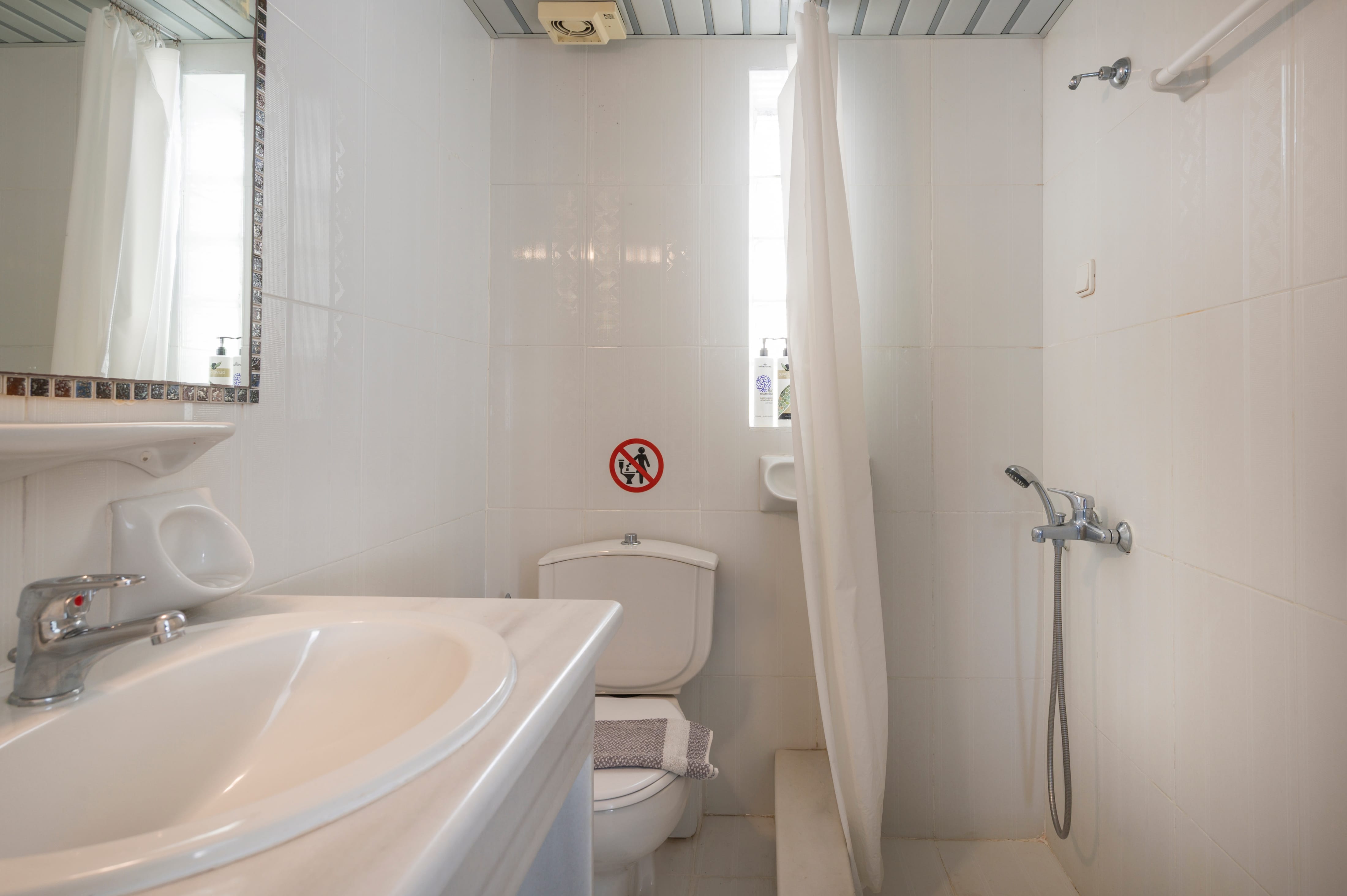 a bathroom with a sink and toilet