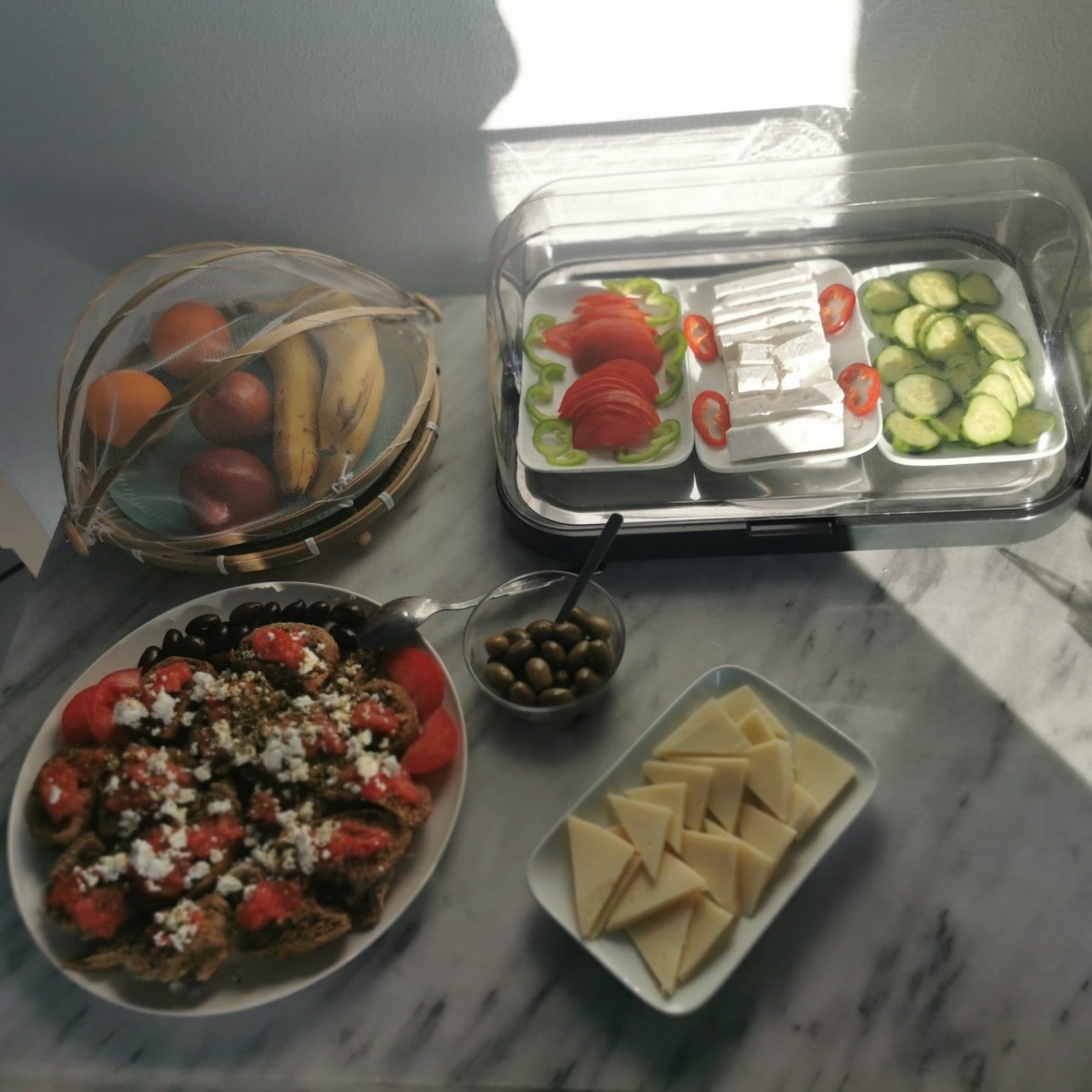 a table with food and containers of food on it