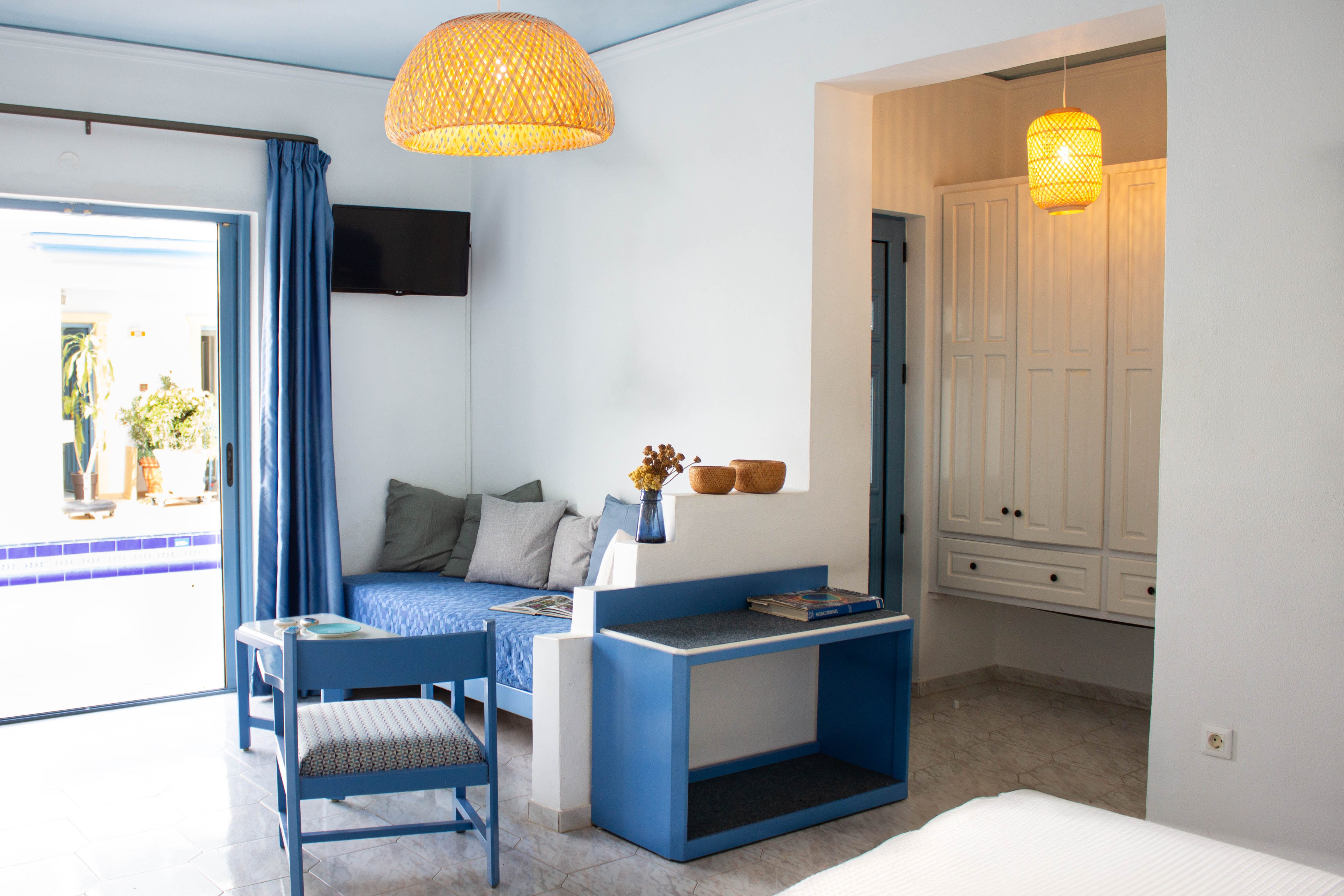 a room with a blue table and chairs