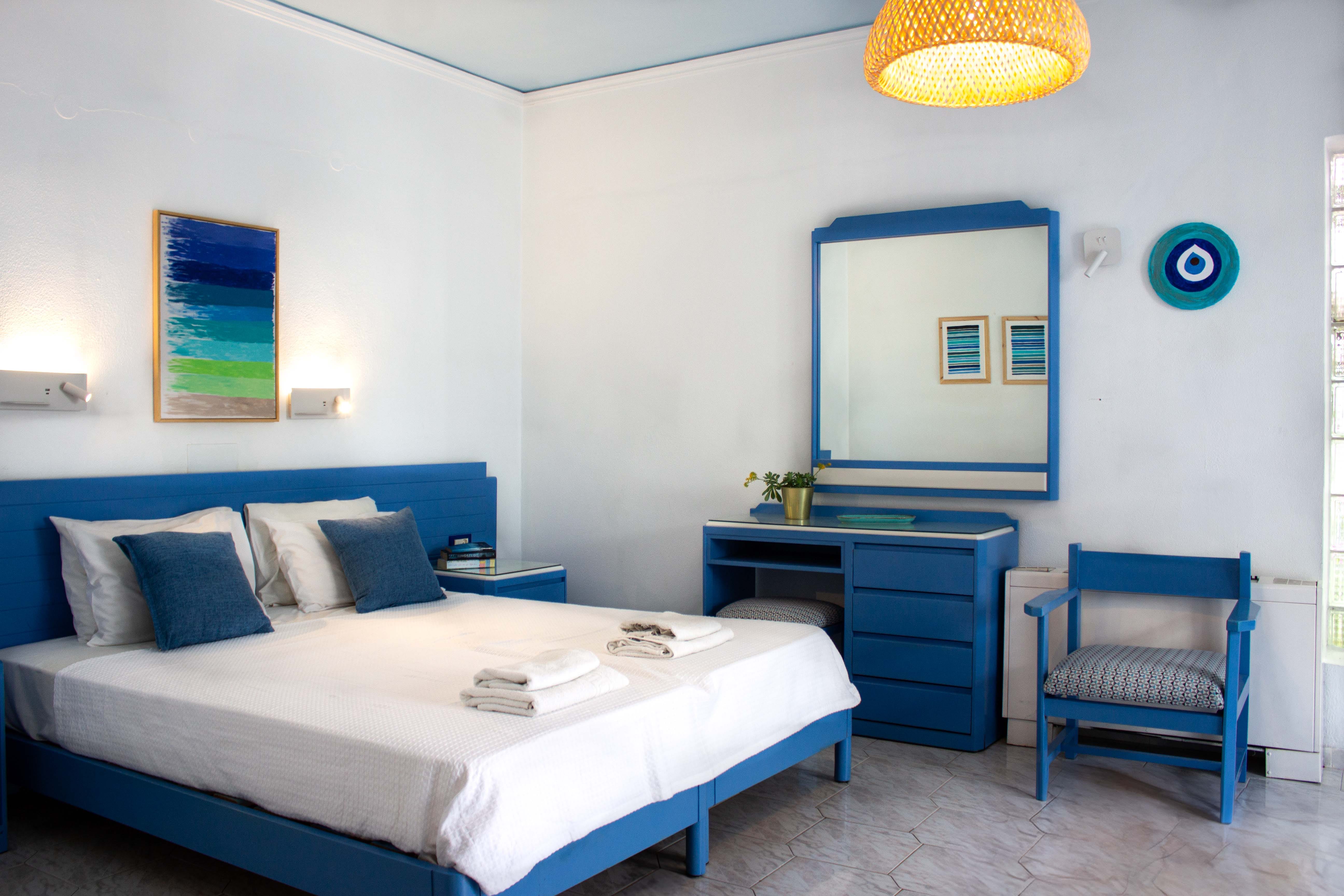 a bedroom with a bed and a chair