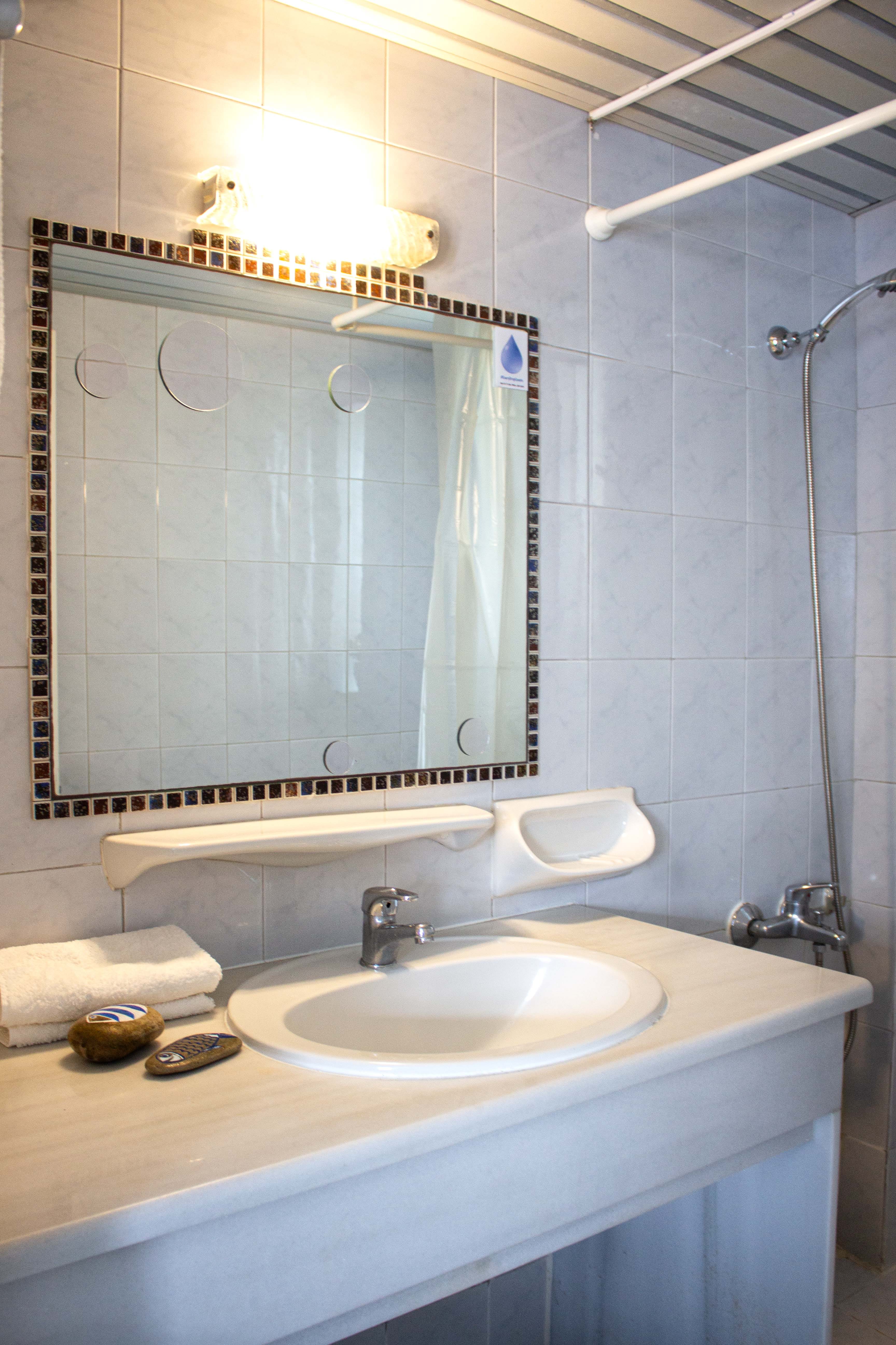 a bathroom with a mirror and sink