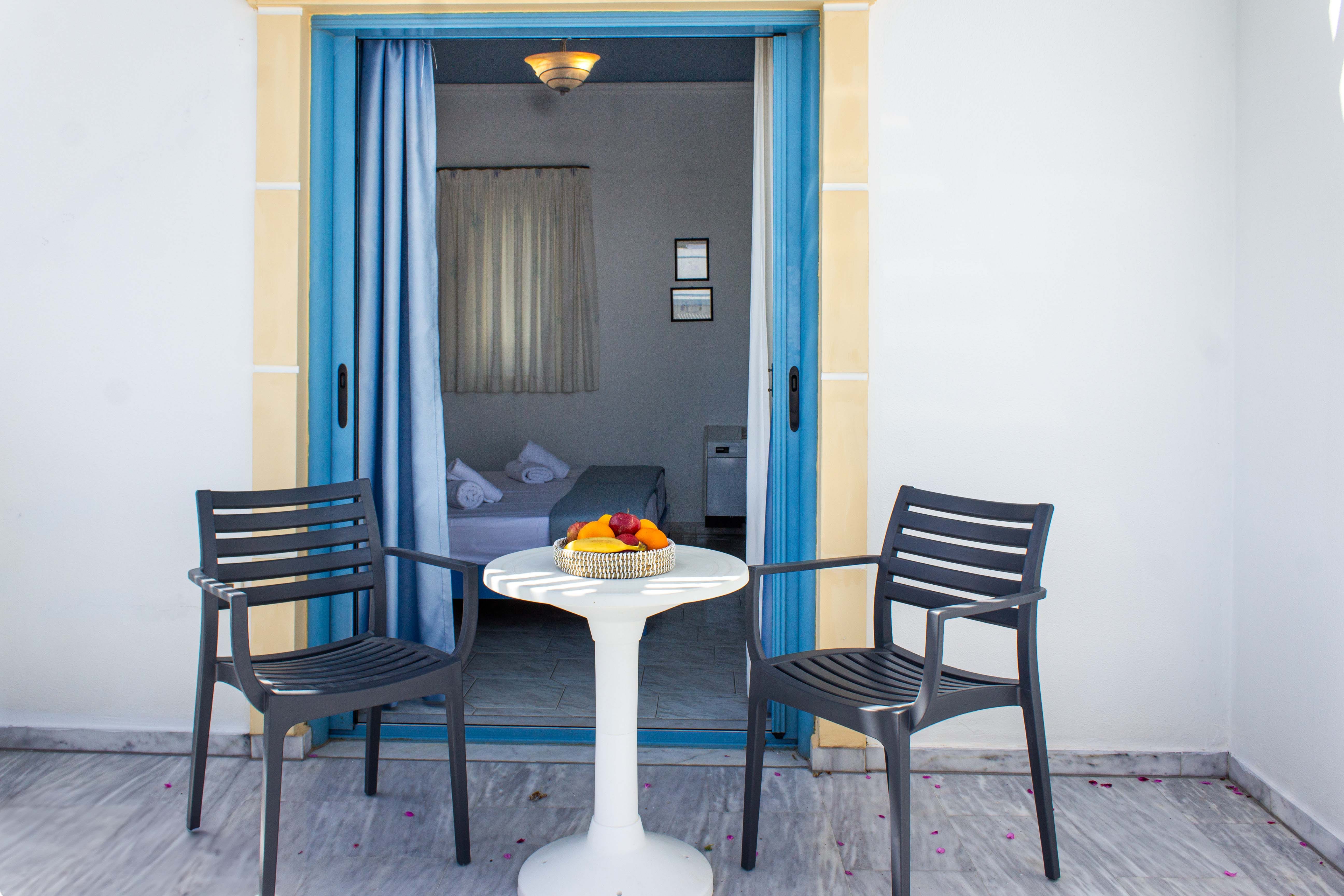 a room with a table and chairs