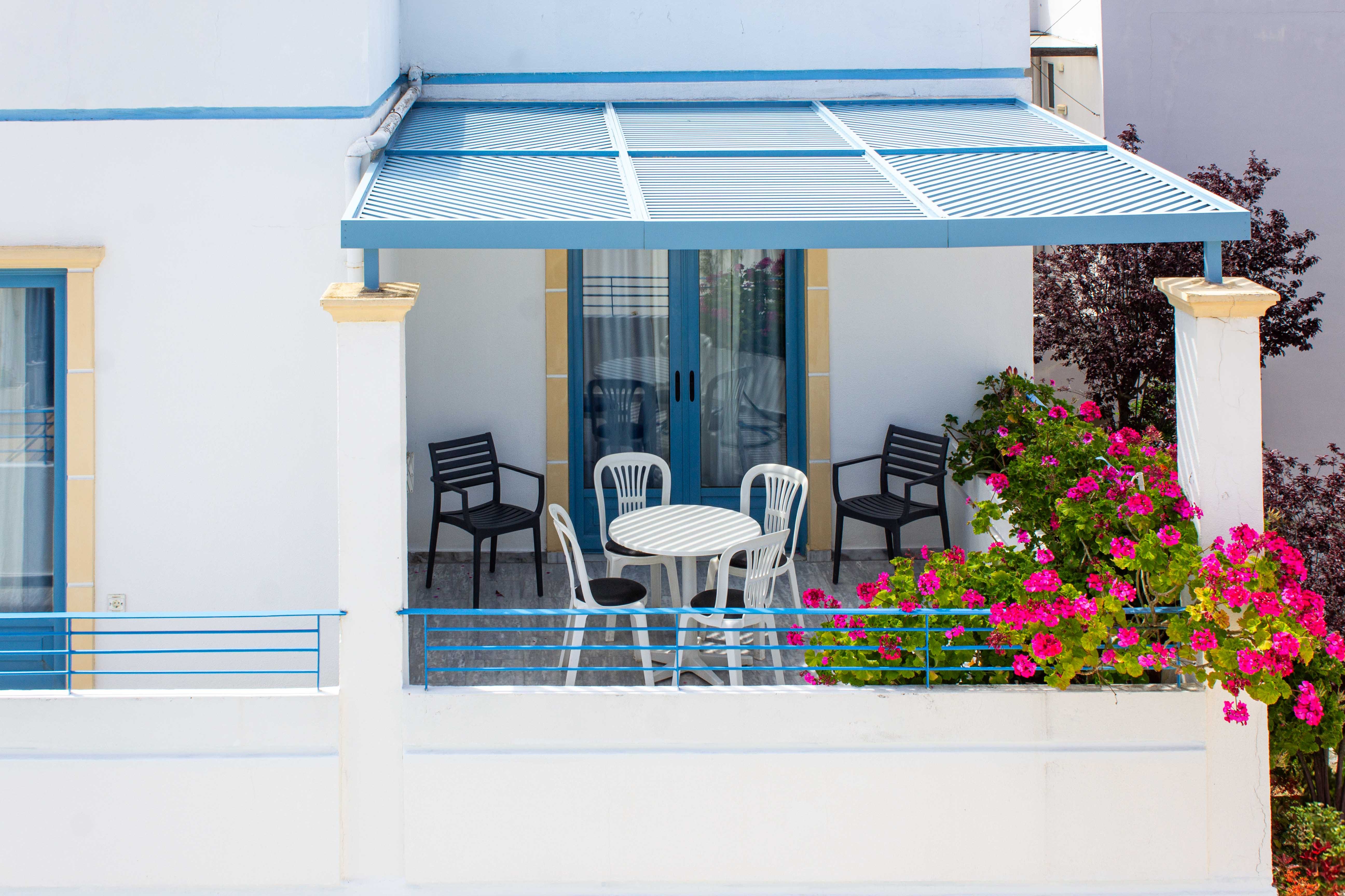 a table and chairs on a balcony