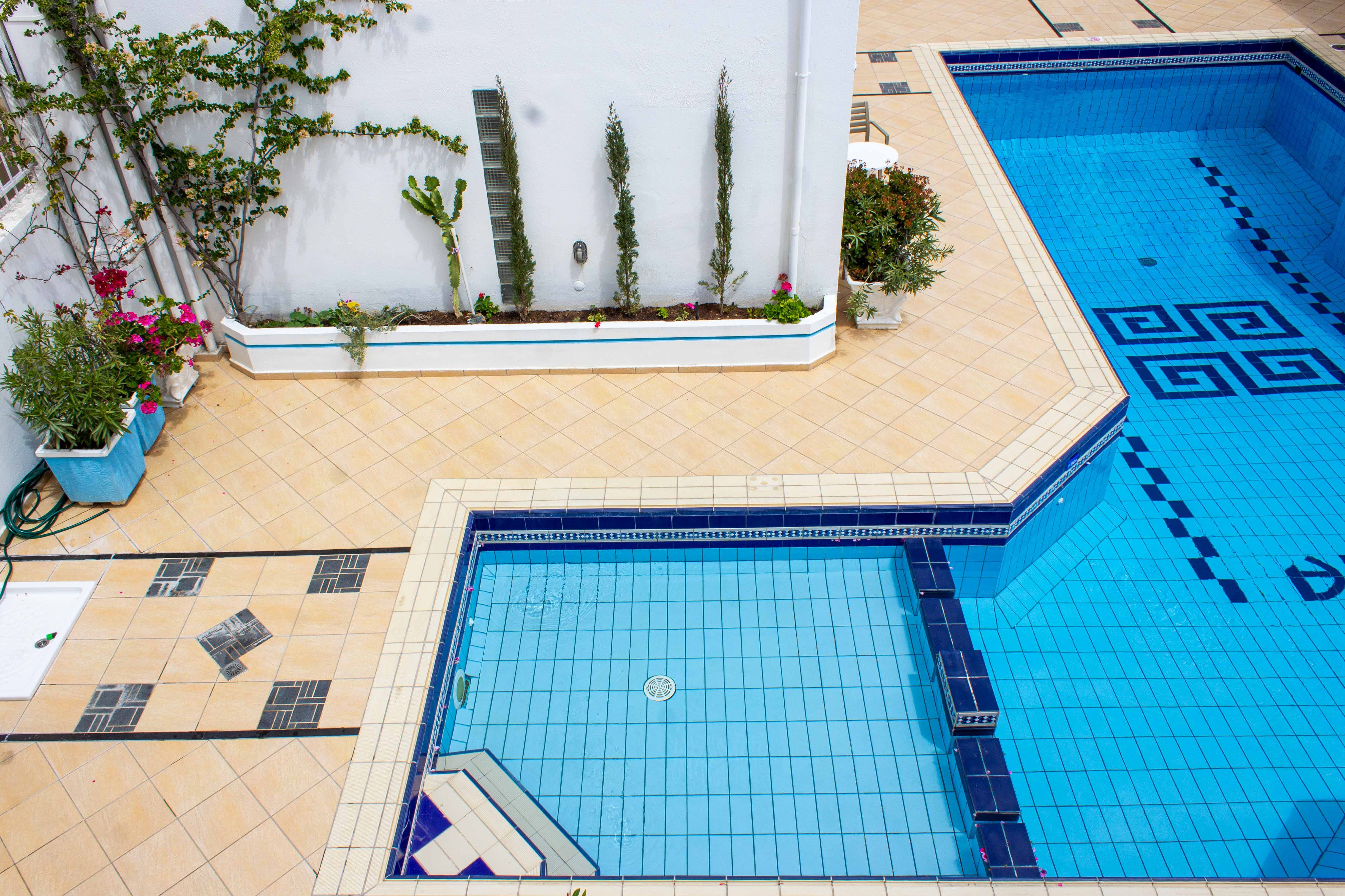 a pool with a building in the background