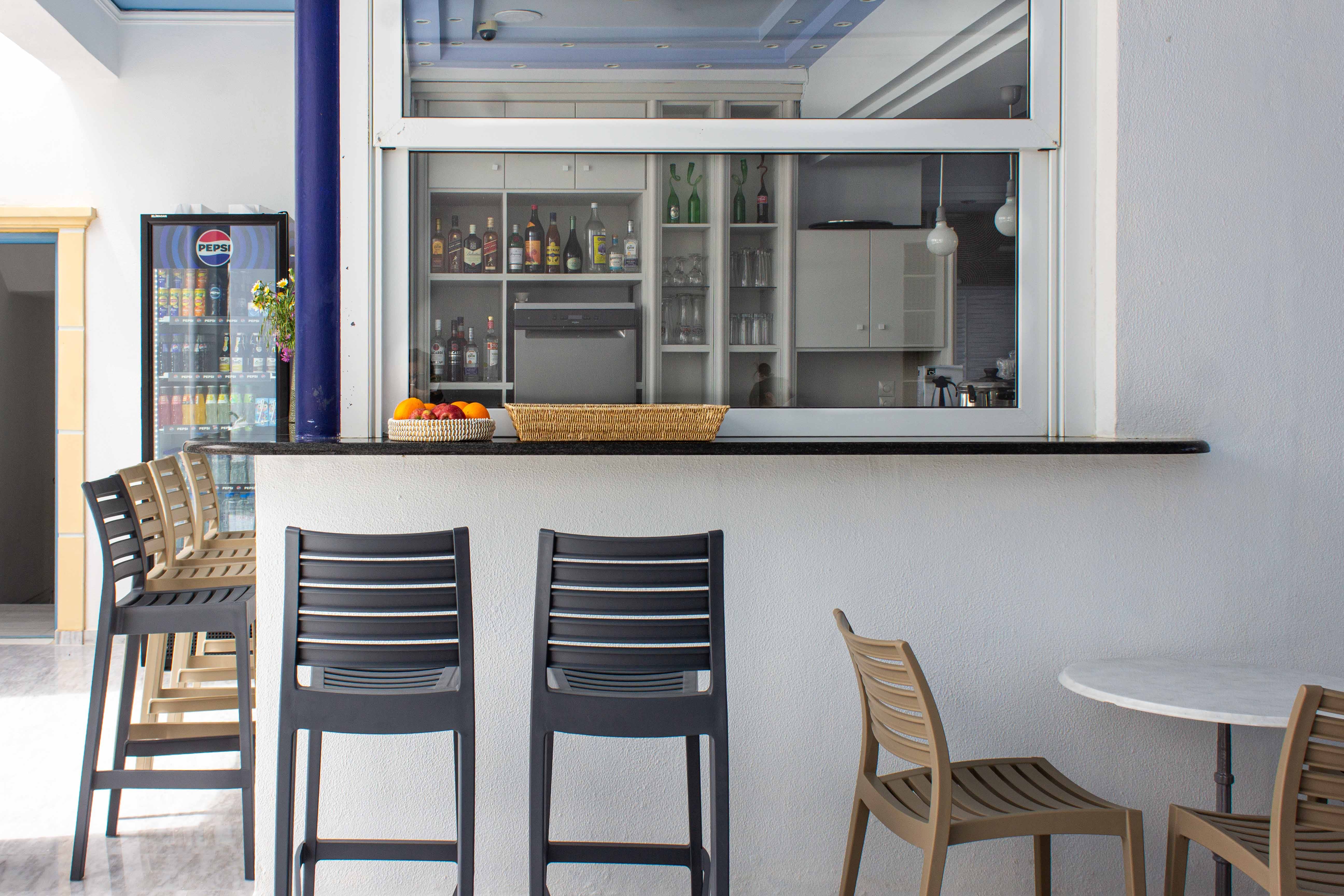 a kitchen with a table and chairs