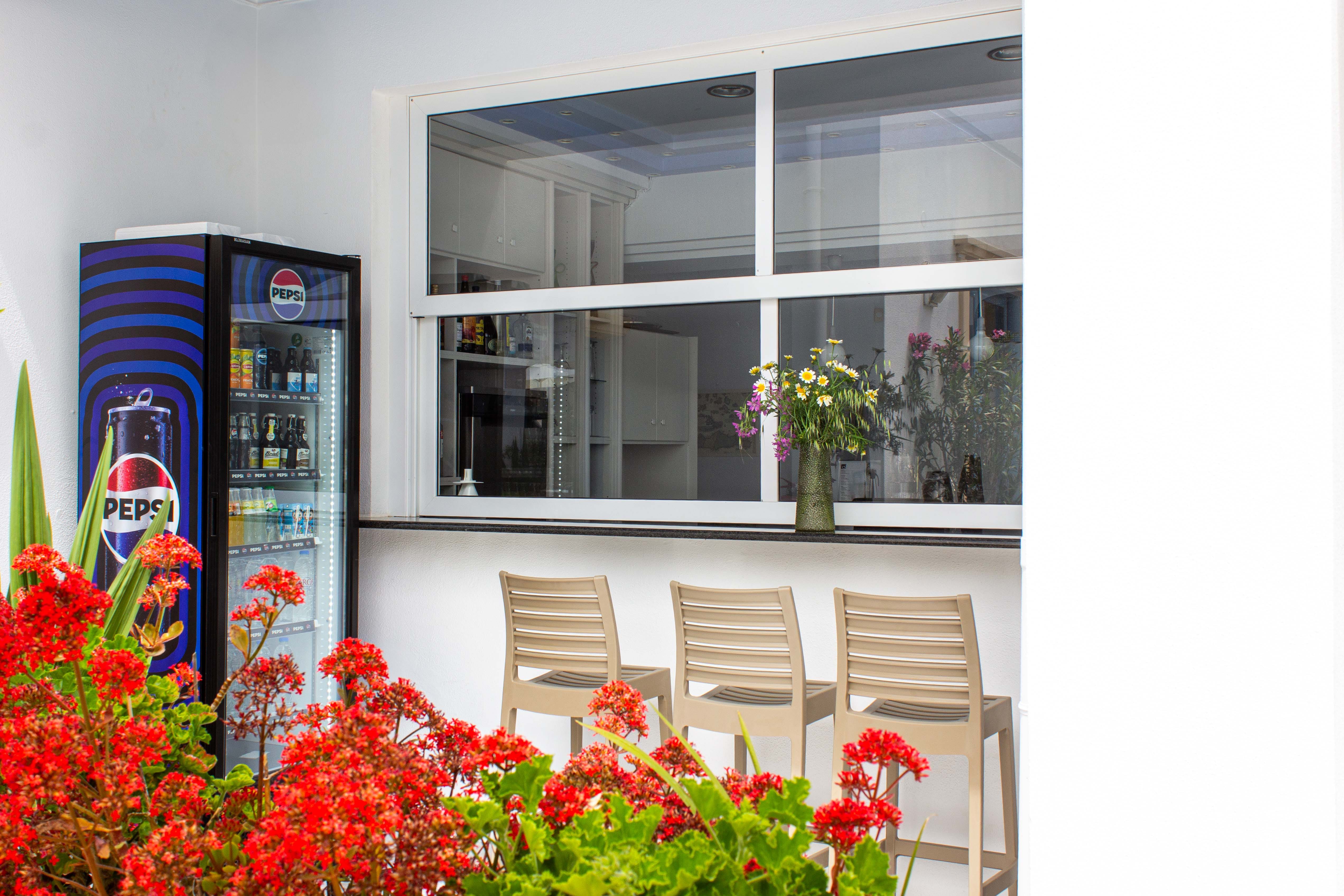 a table with chairs and a window