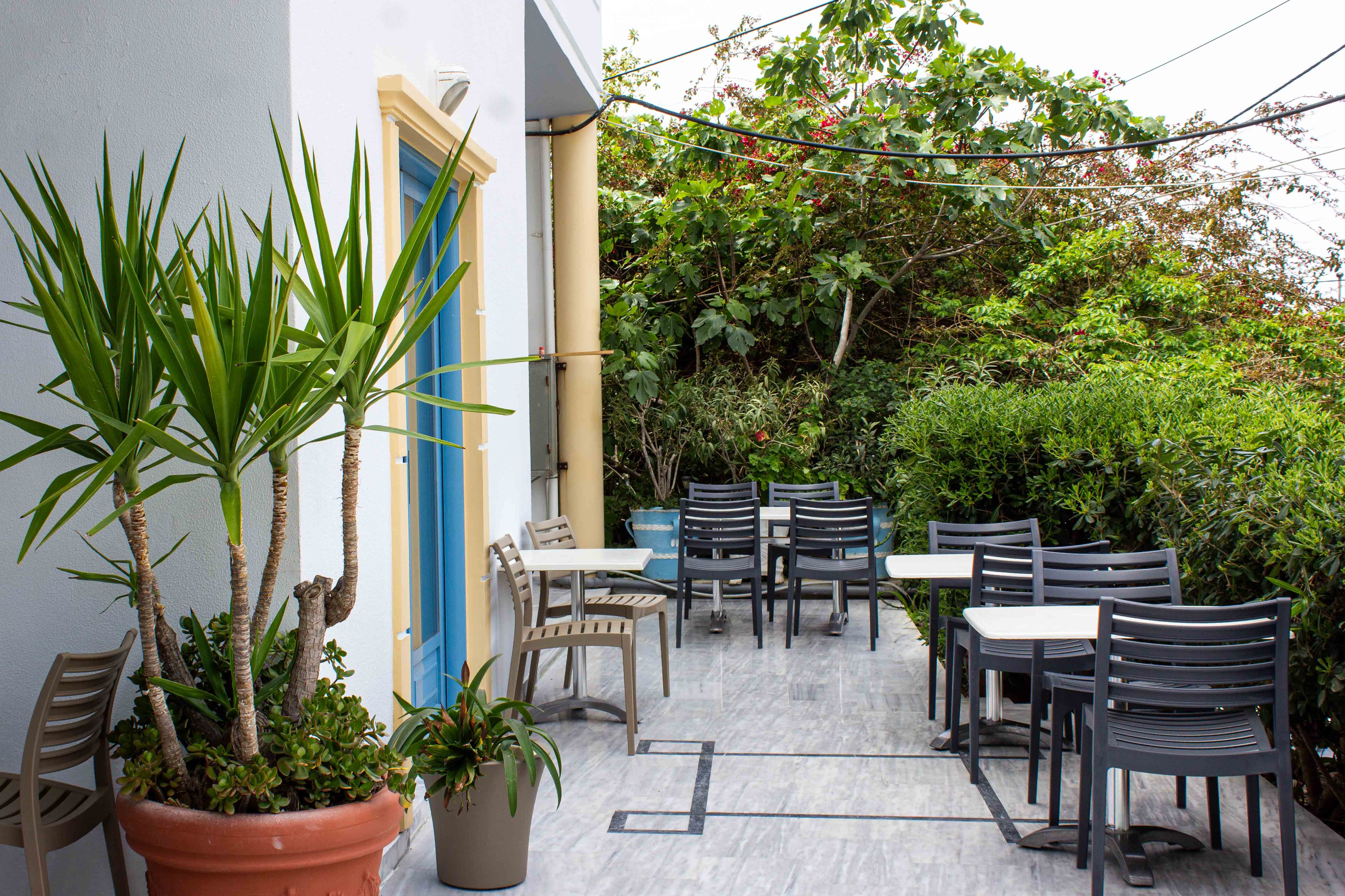 a patio with tables and chairs