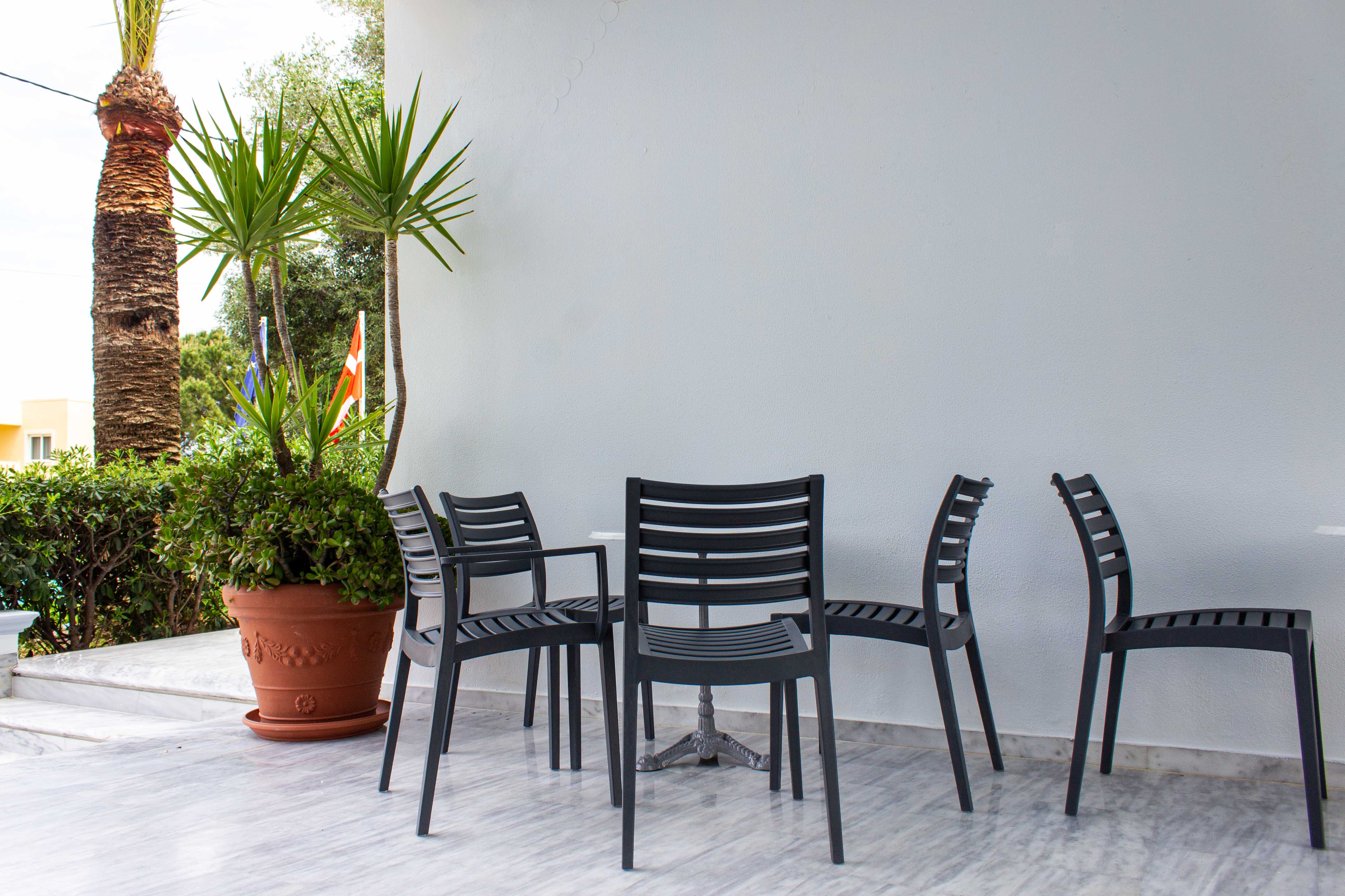 a group of chairs and a table outside