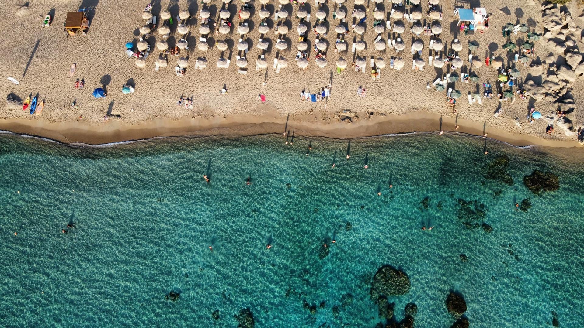 a large crowd of people at a beach