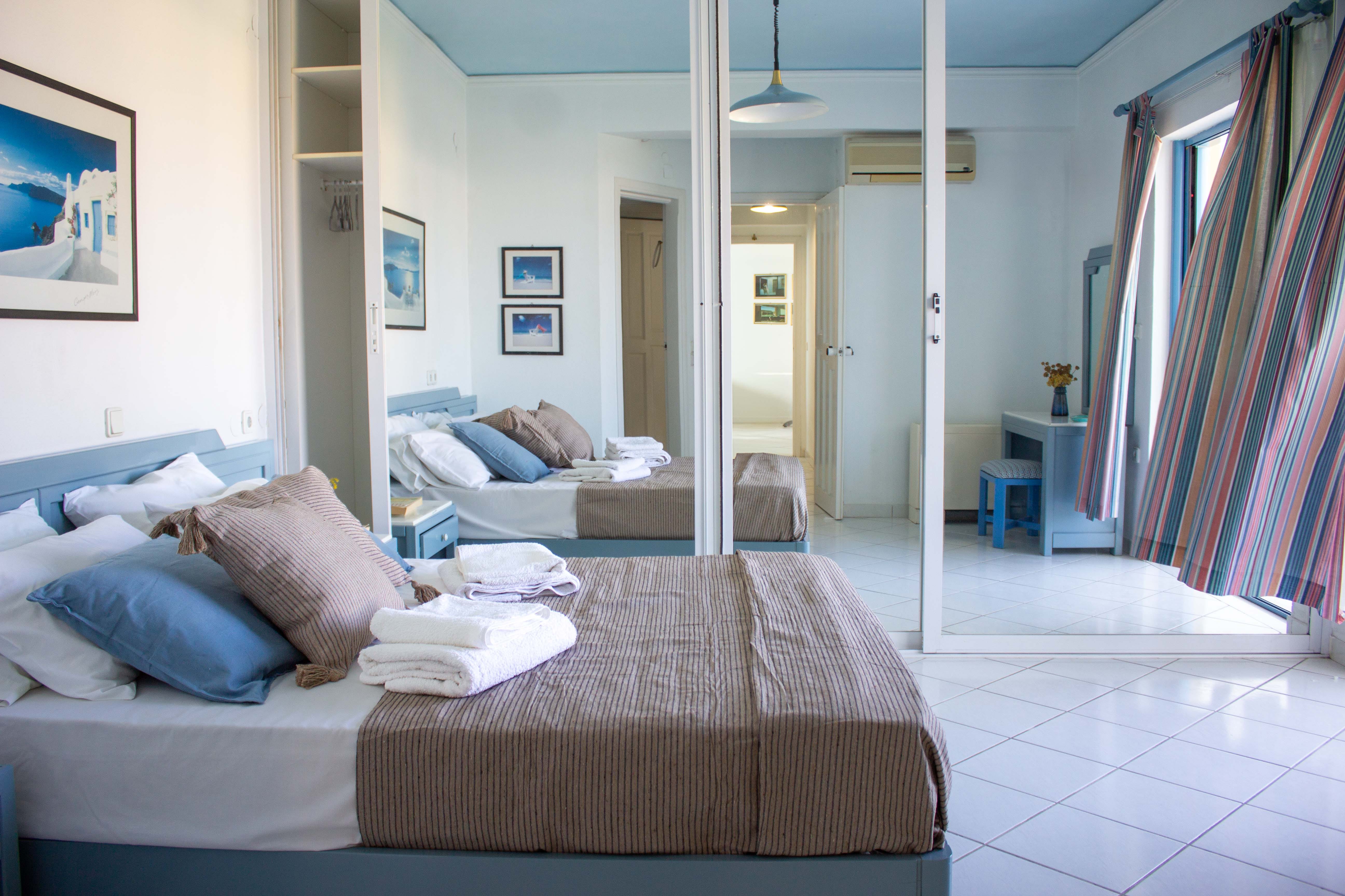 a bedroom with a bed and a couch