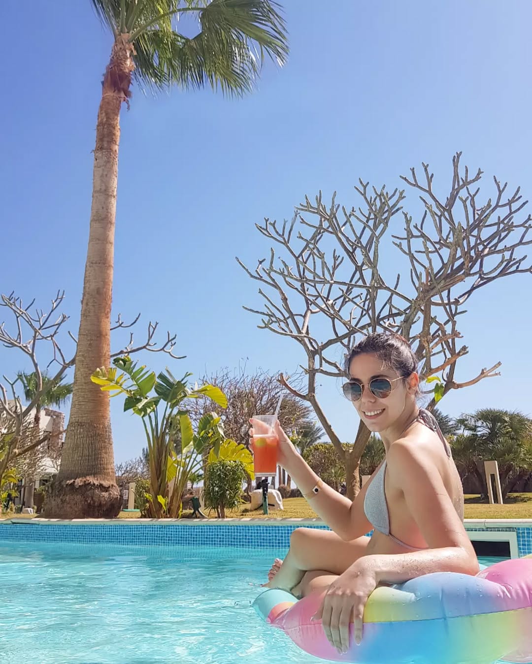 a person sitting on a pool