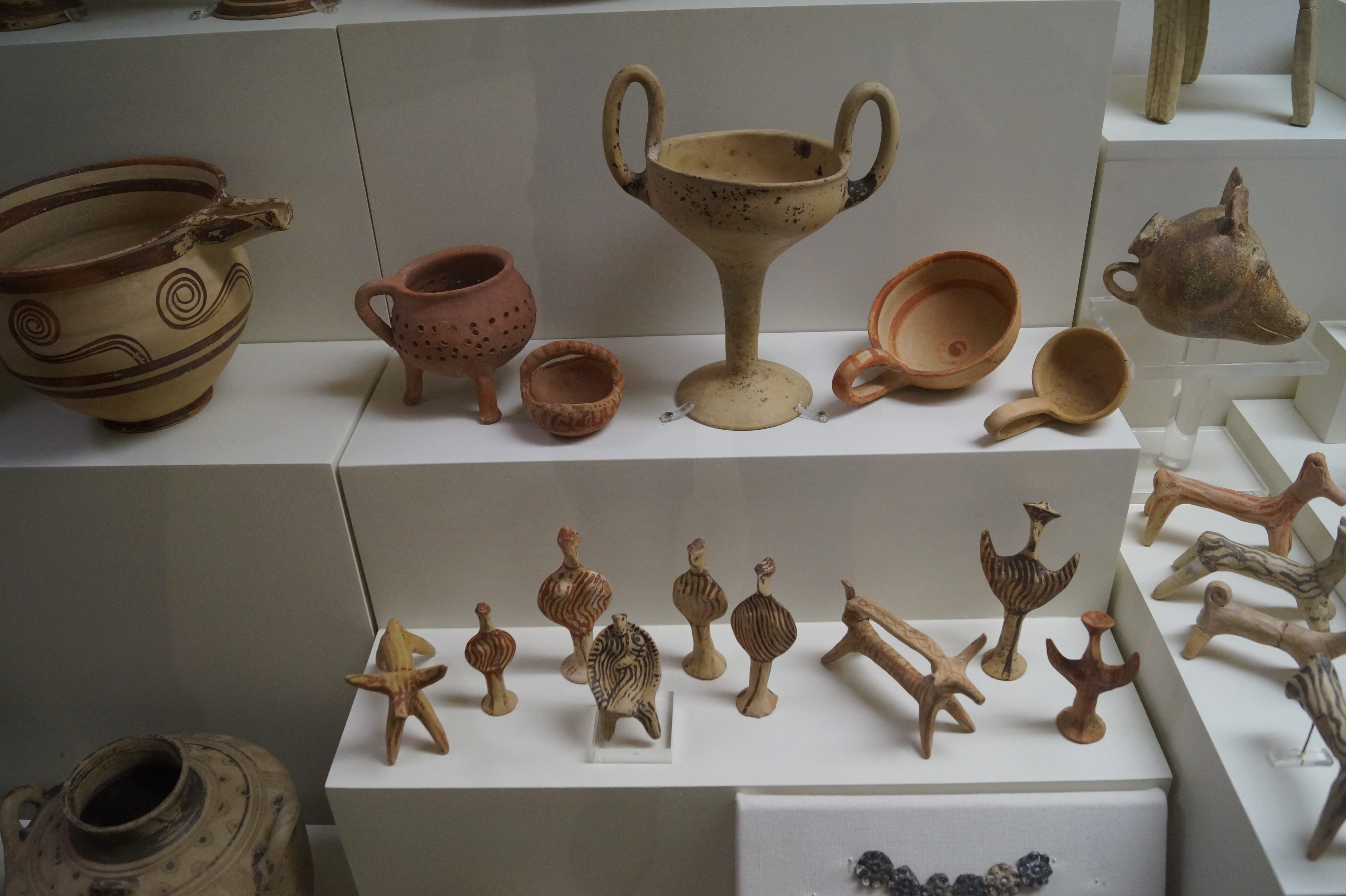 a shelf with pottery on it