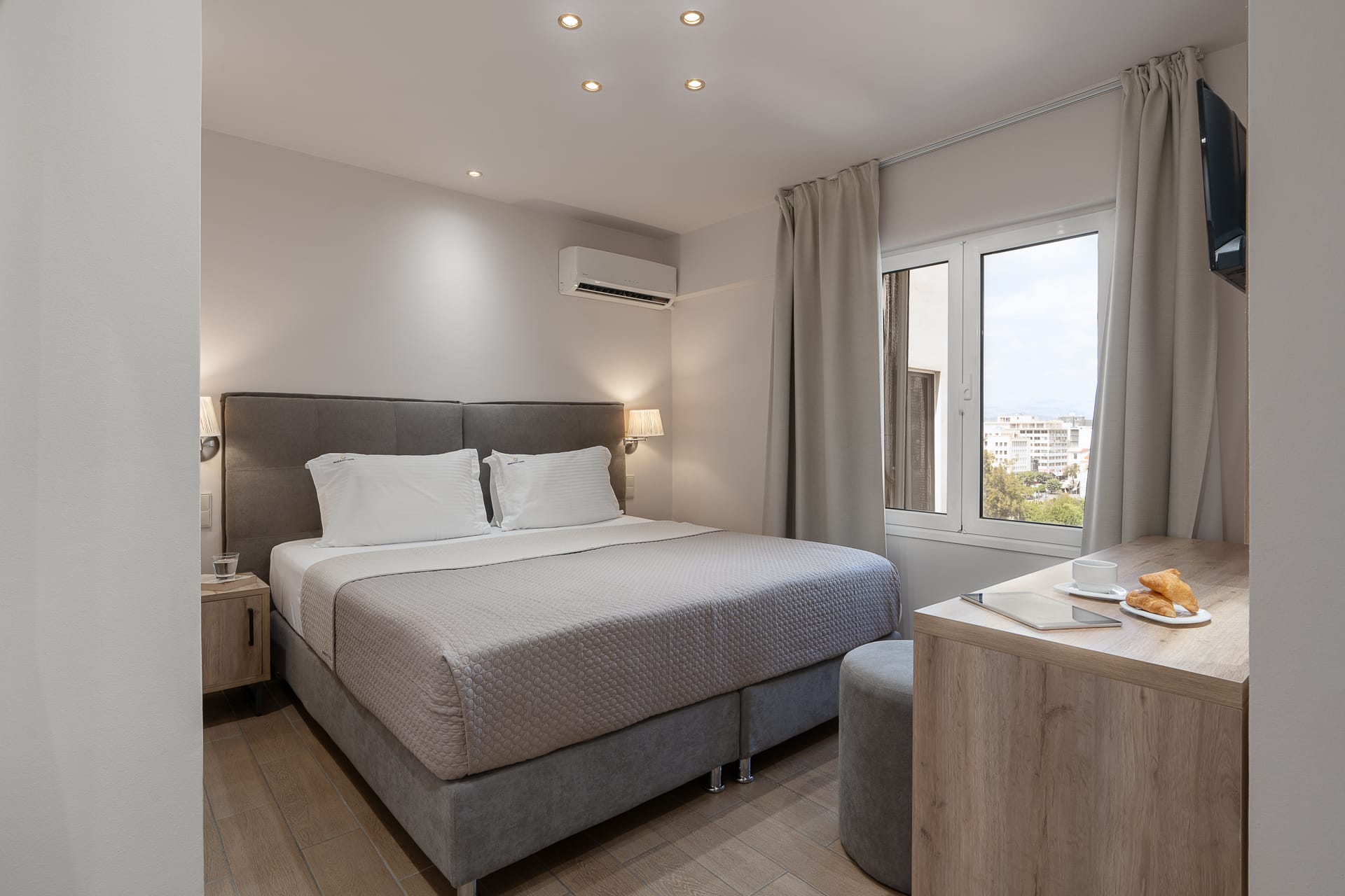 a bedroom with a bed and a desk