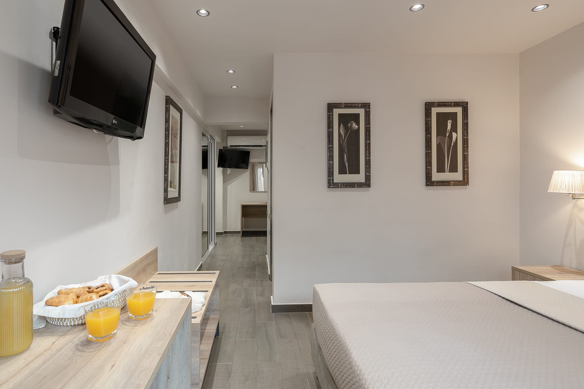 a room with a tv and a table with food on it