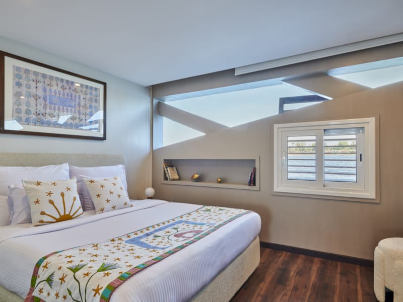 a bedroom with a bed and a mirror