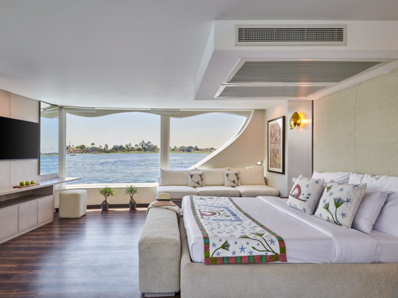 a bedroom with a large window