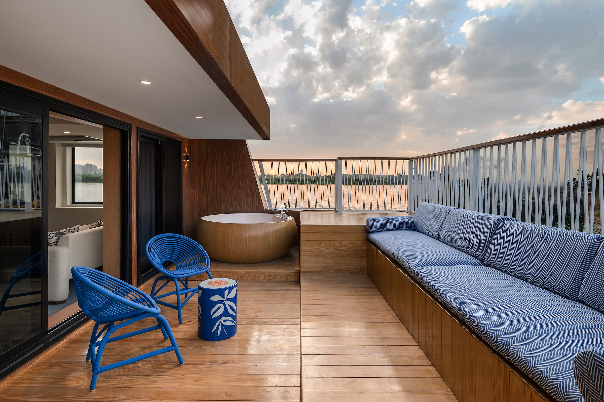 a room with a couch and chairs