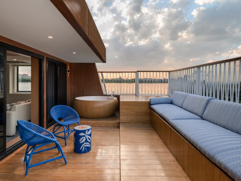 a room with a couch and chairs