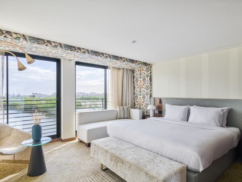 a bedroom with a large window