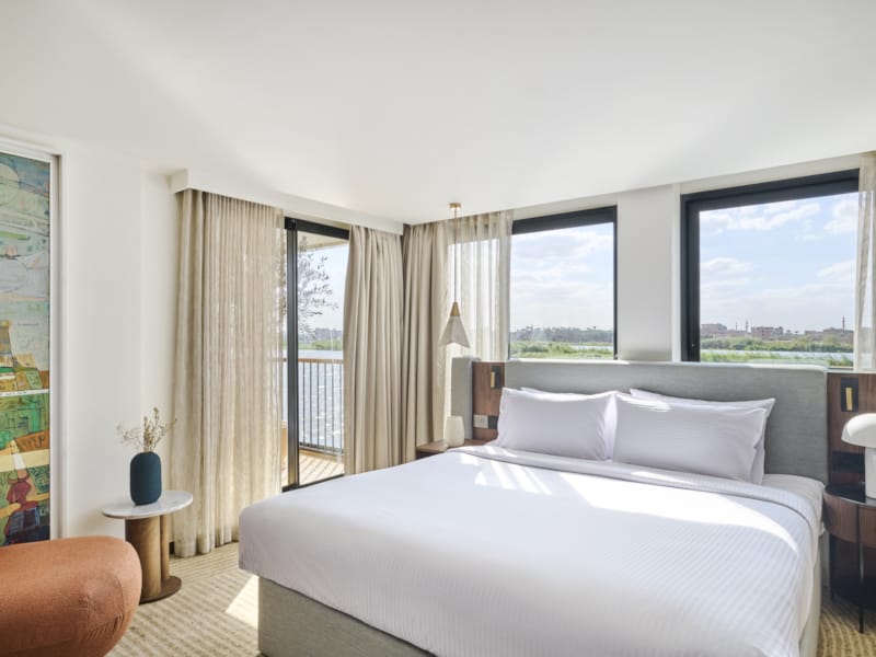 a bedroom with a large window