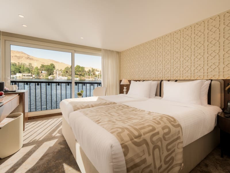 a bedroom with a large window