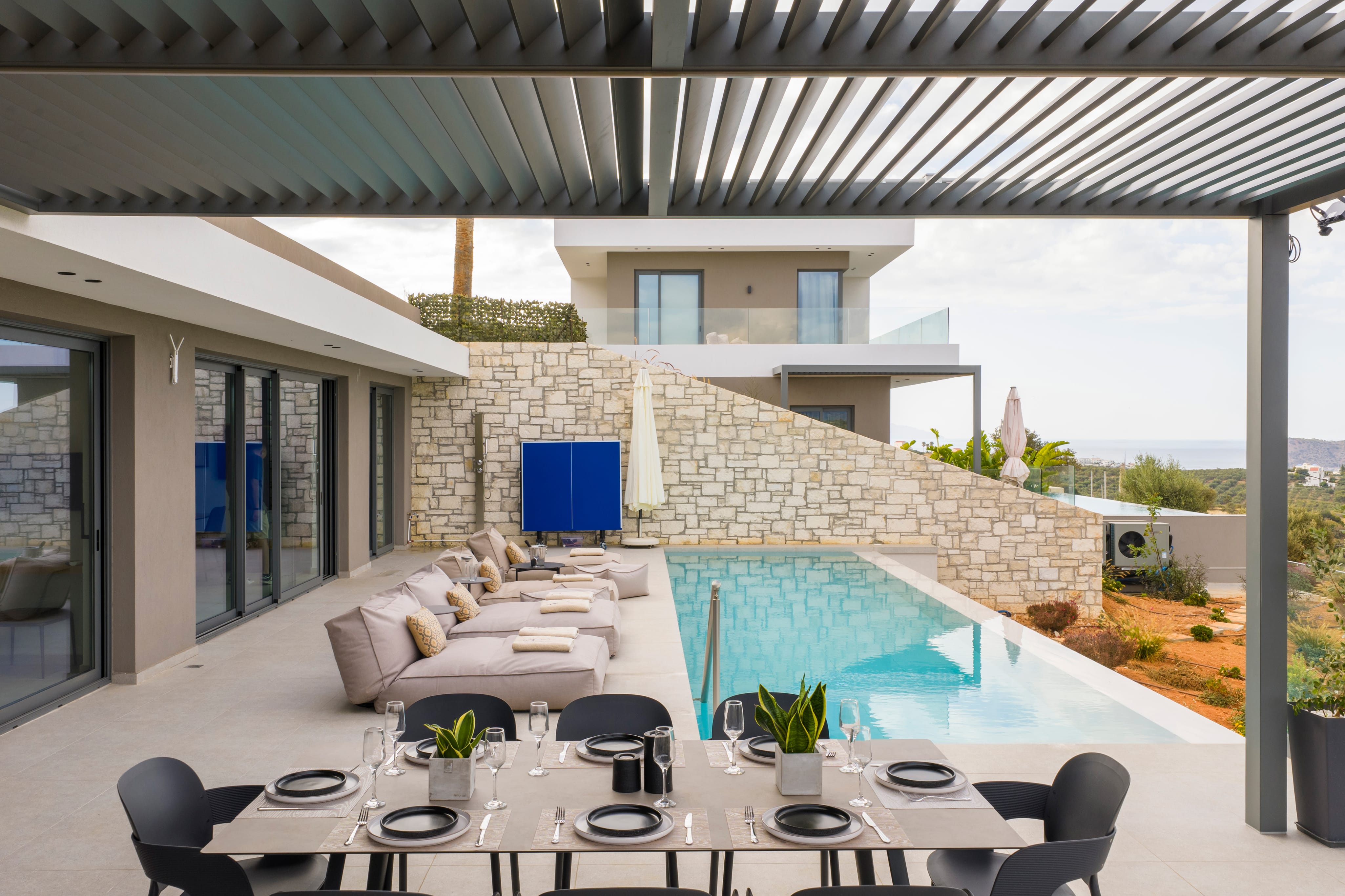 a large room with a pool and chairs