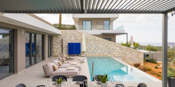 a large room with a pool and chairs