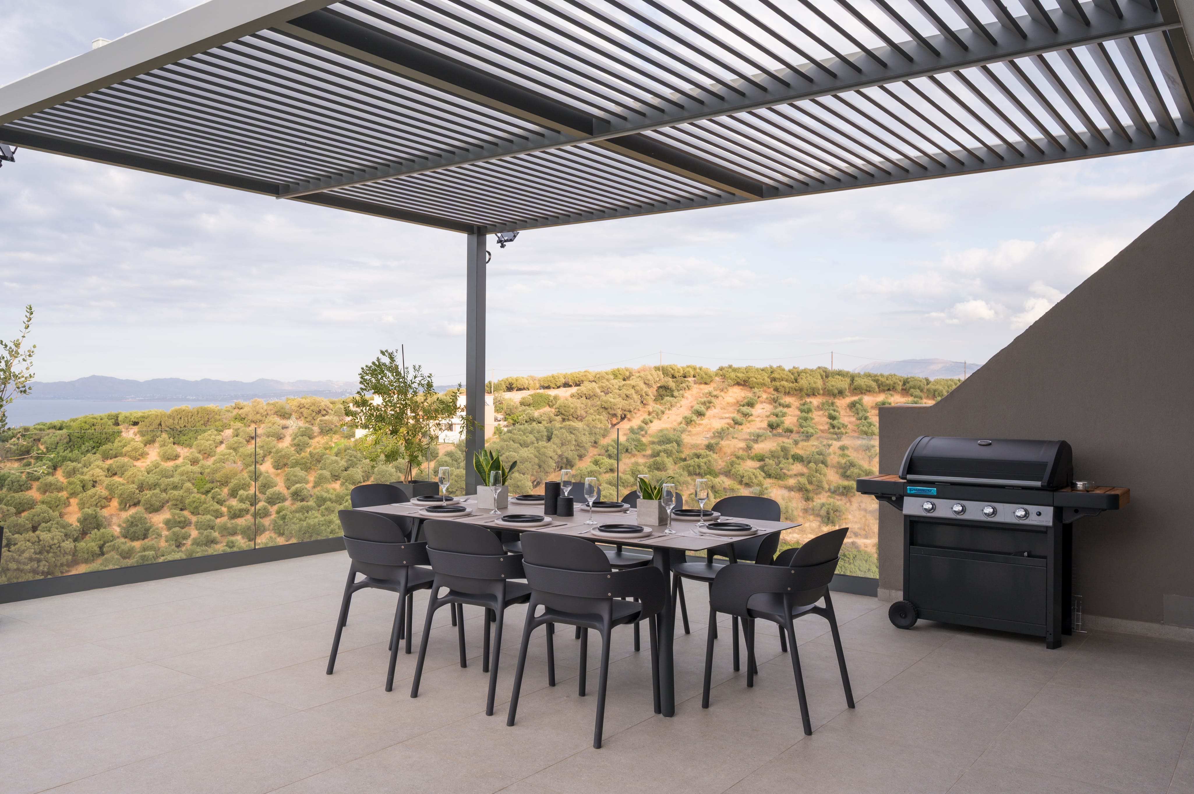 a table with chairs and a grill