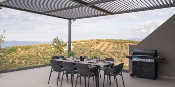 a table with chairs and a grill