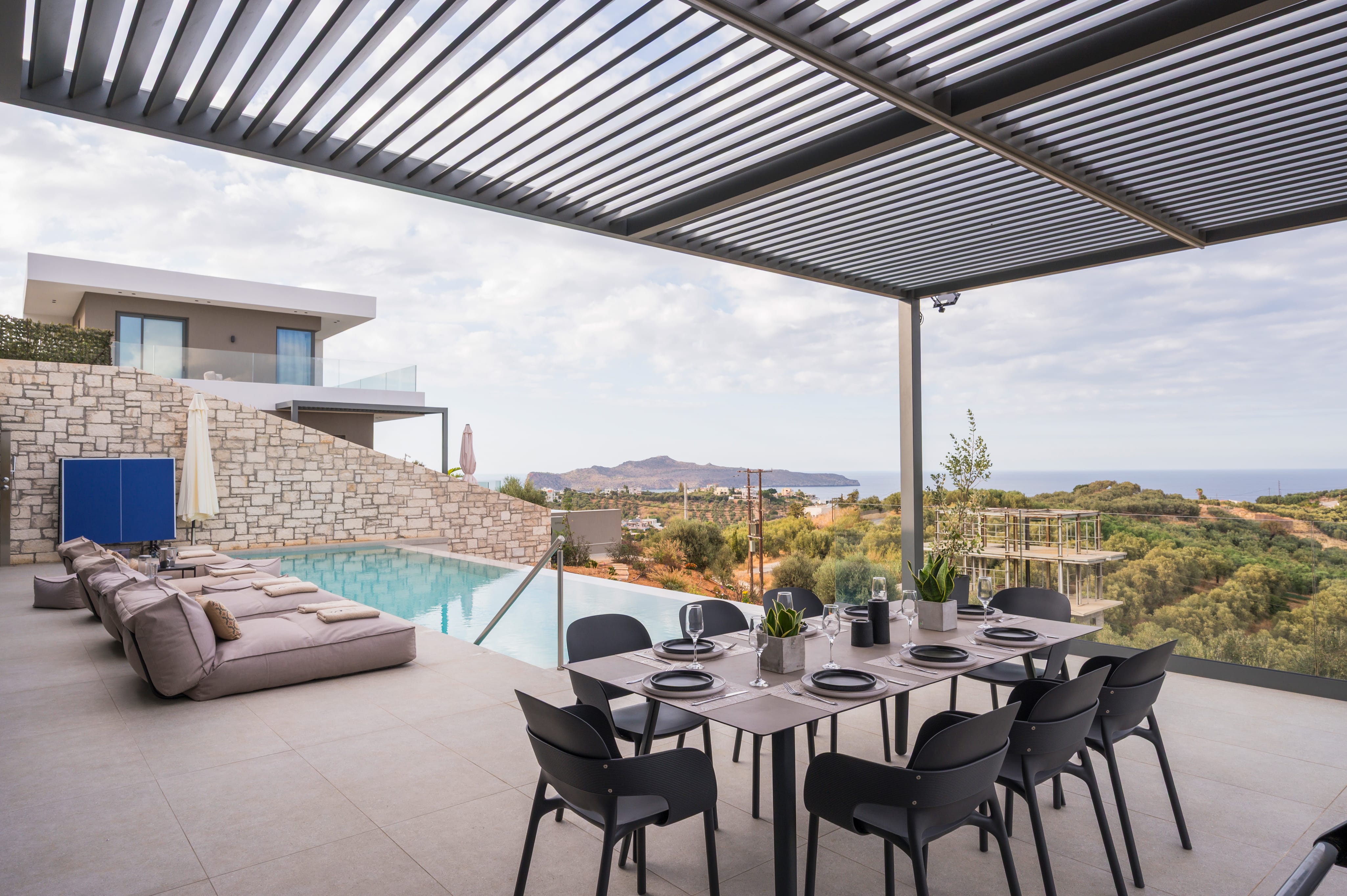 a table with chairs and a pool