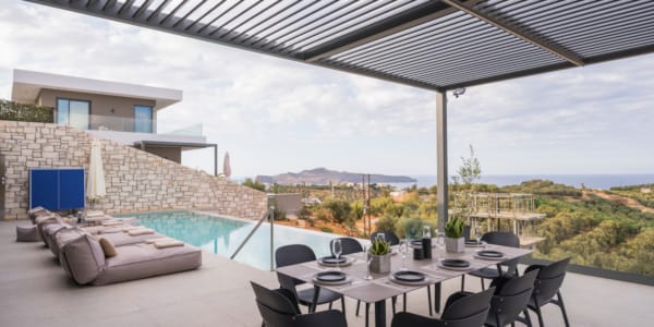 a table with chairs and a pool