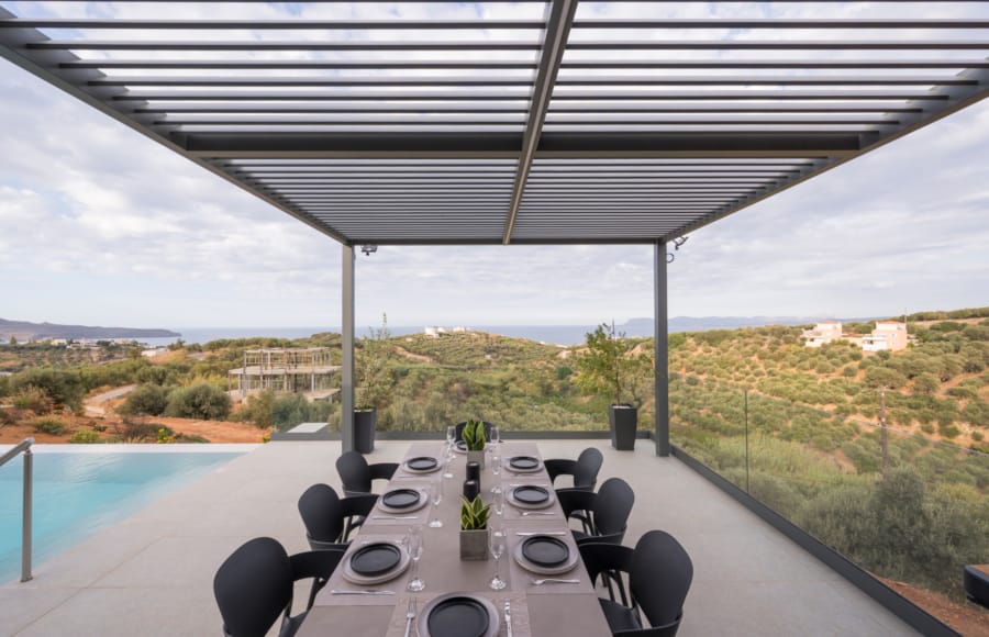 a table with a drink on it by a pool