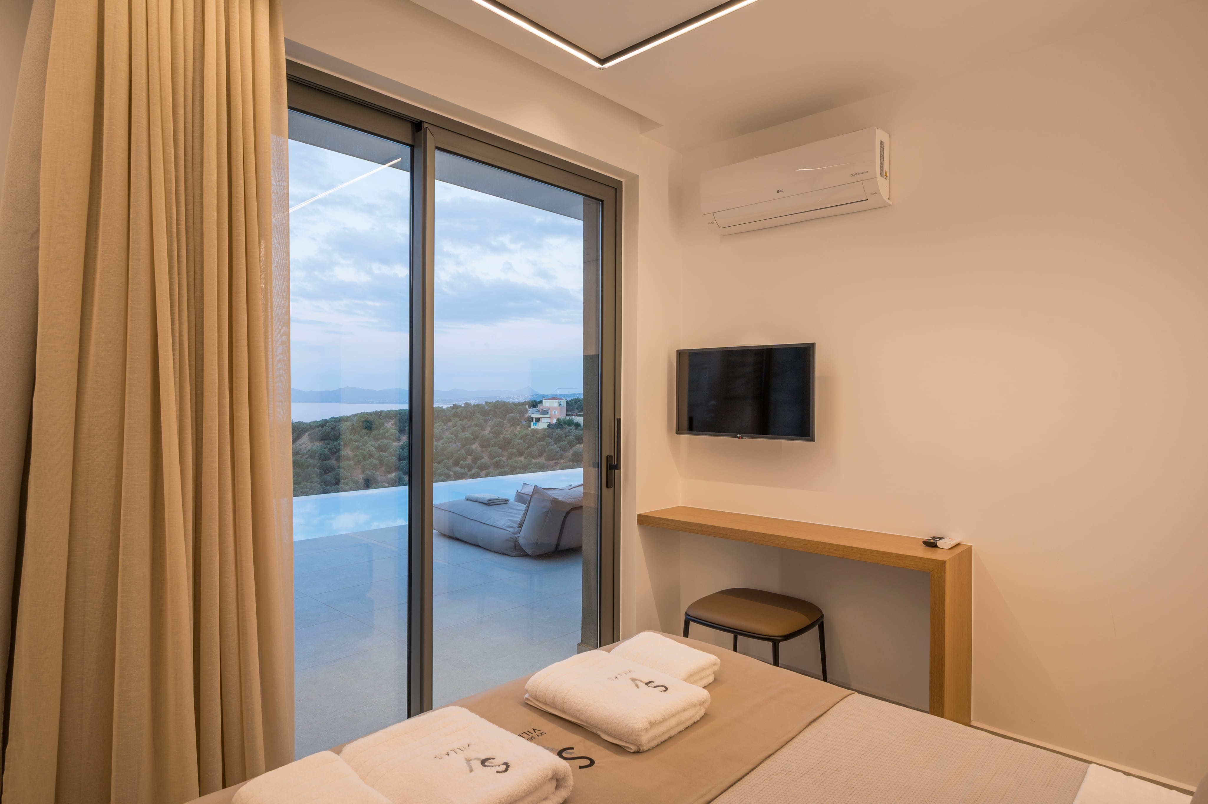 a bedroom with a large window