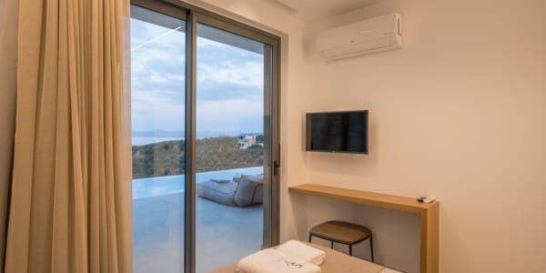 a bedroom with a large window