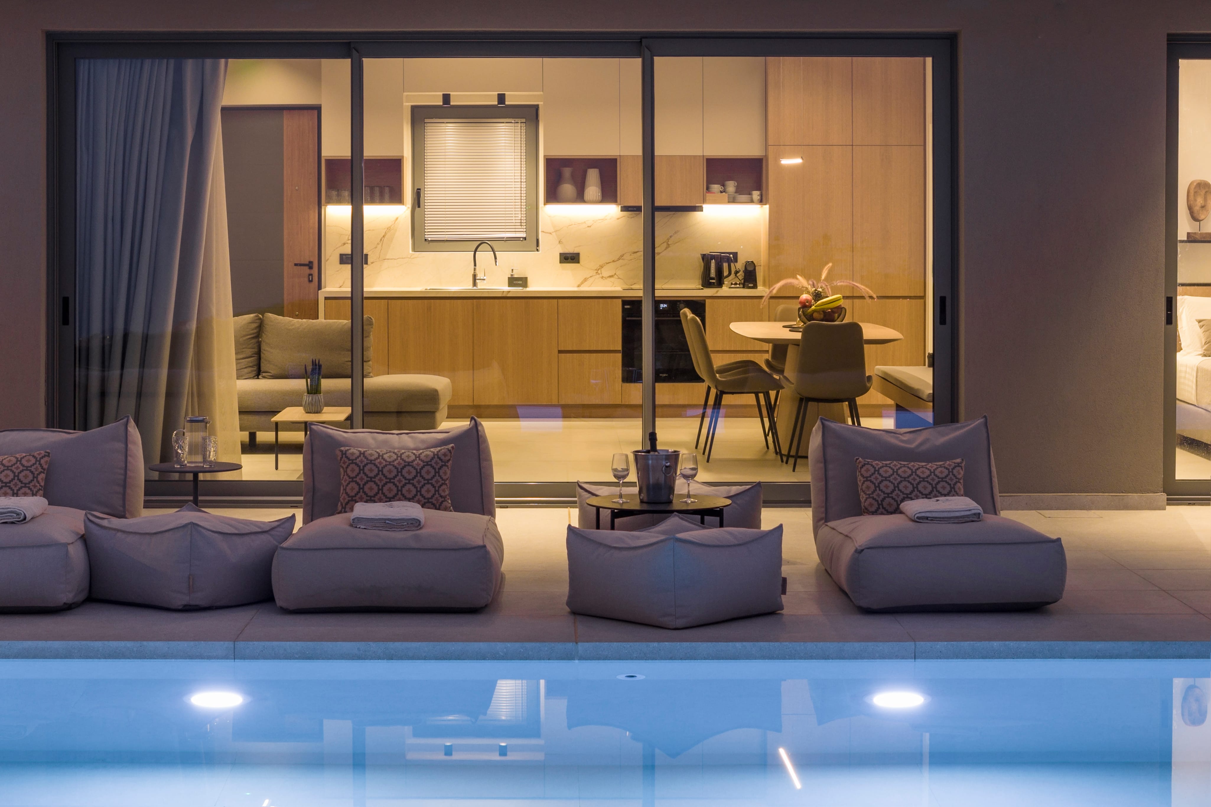 a room with a pool table and chairs