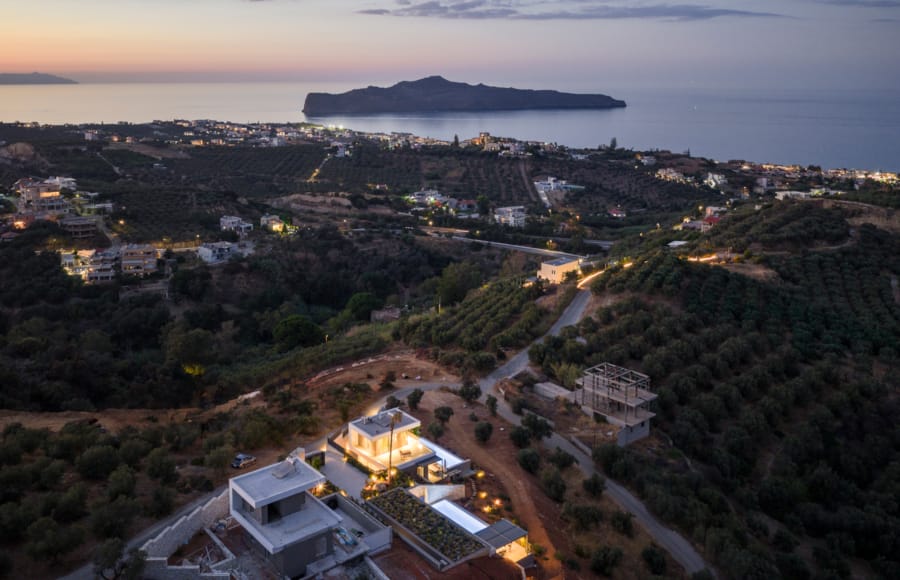 a city with a body of water in the background