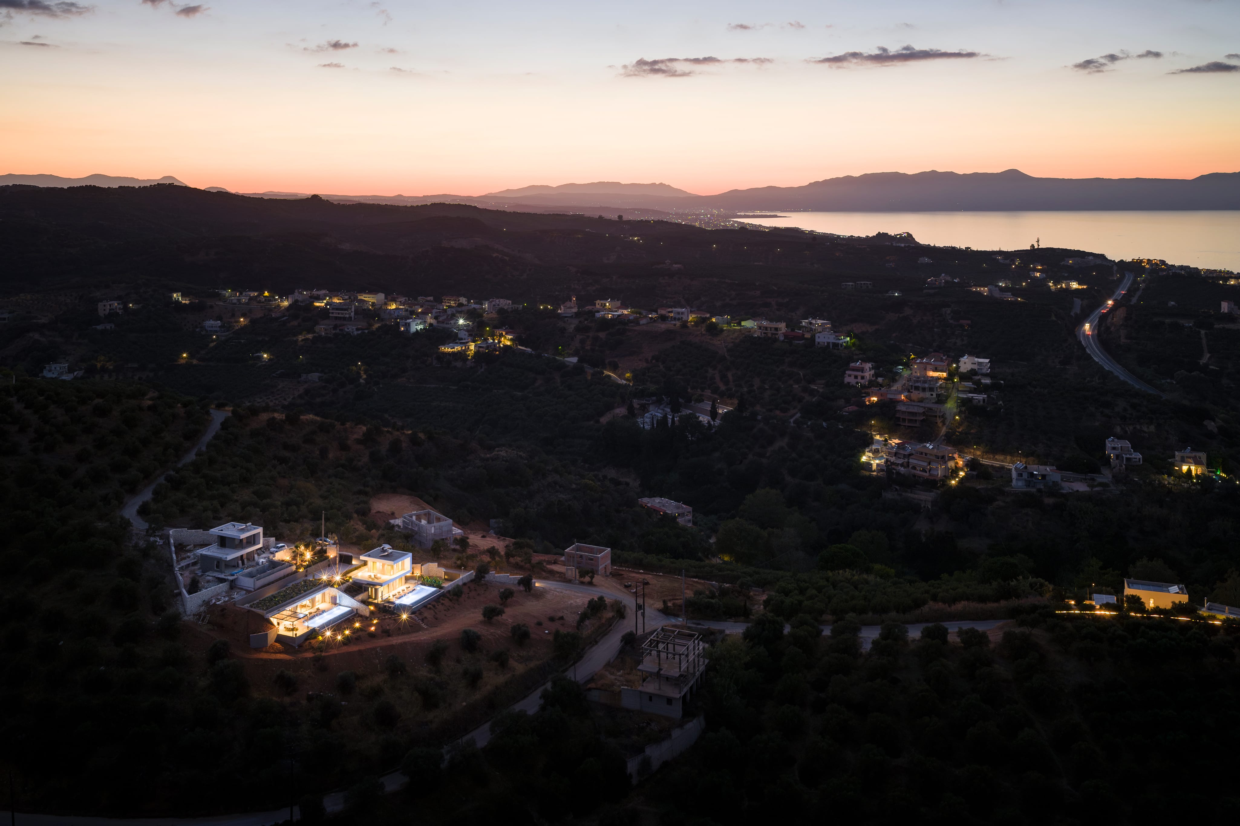 a city with a body of water in the background
