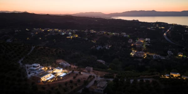a city with a body of water in the background