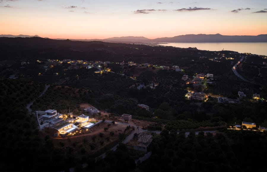 a city with a body of water in the background