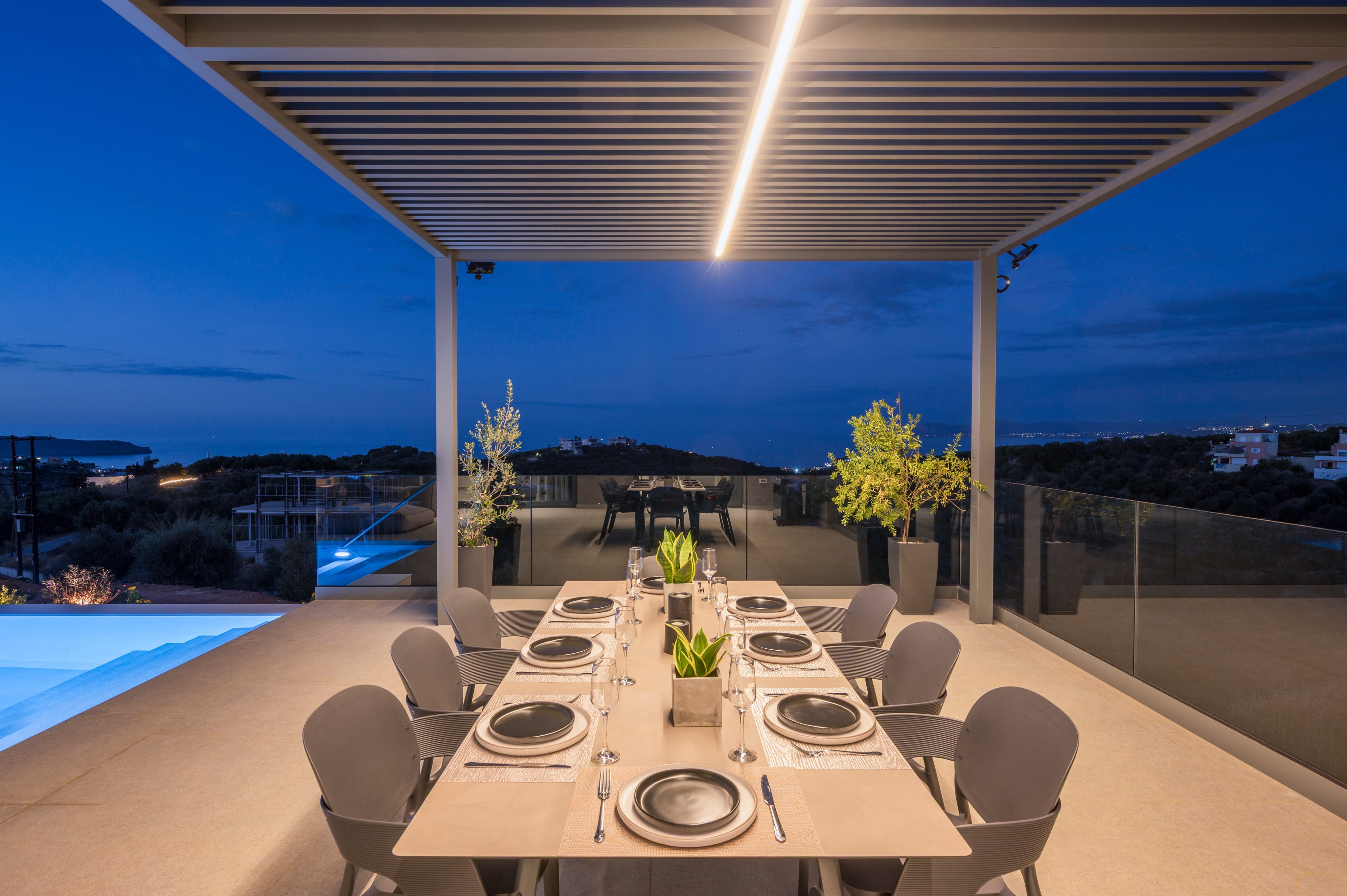 a table with chairs and a pool