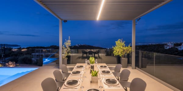 a table with chairs and a pool