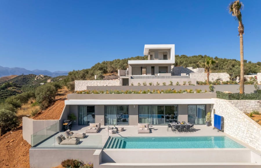 a swimming pool in front of a house