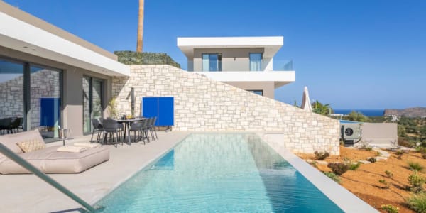 a swimming pool outside of a house