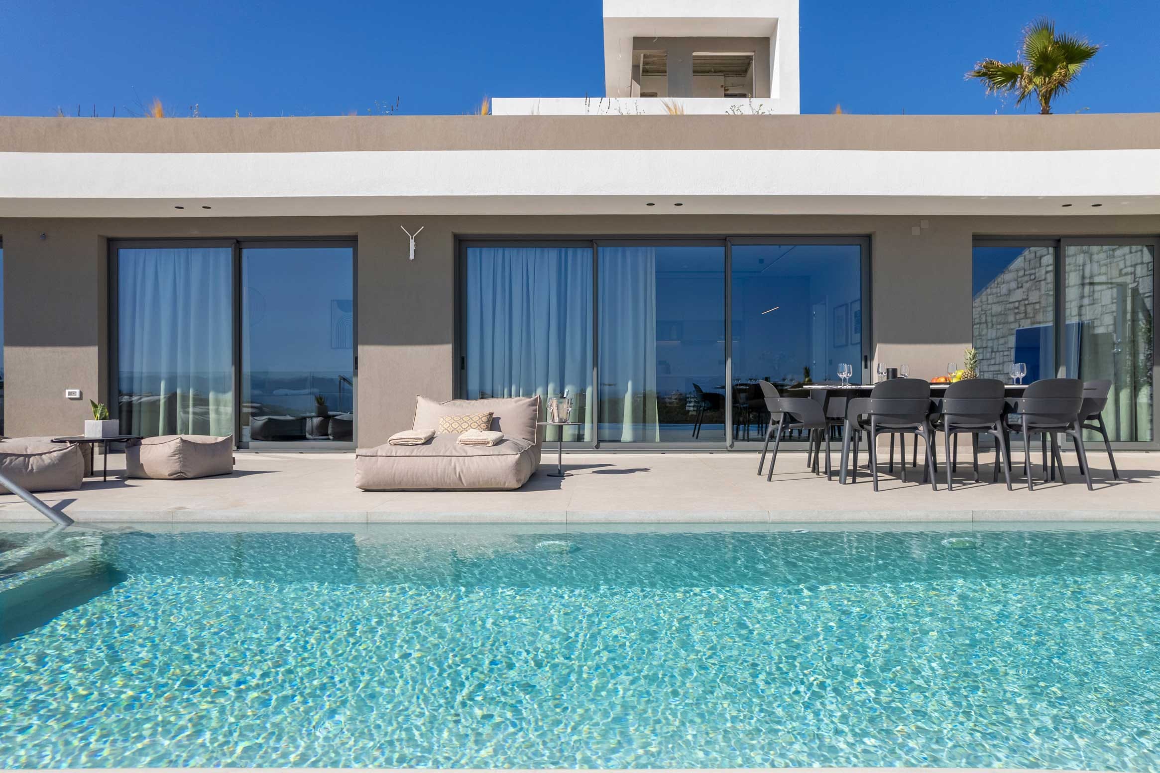 a pool with chairs and a table