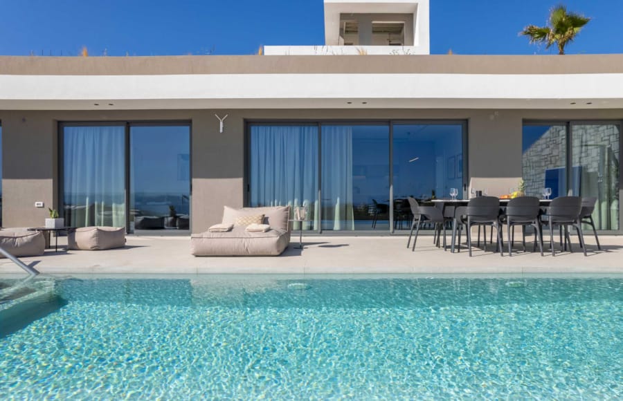 a pool with chairs and a table