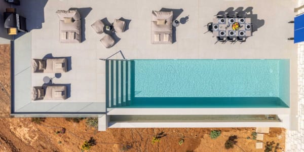 a sign with a building in the background