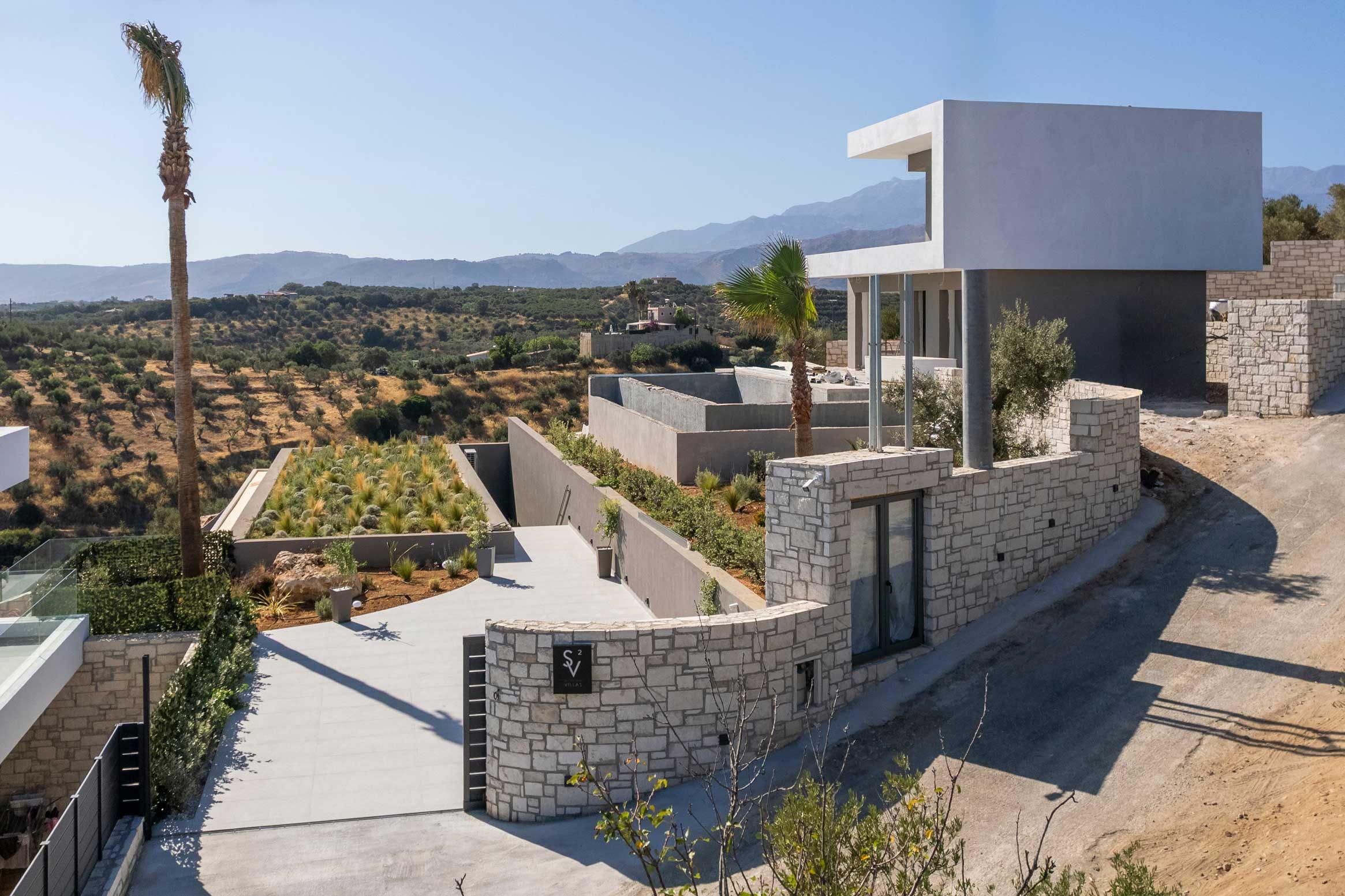 a building with a hill in the background