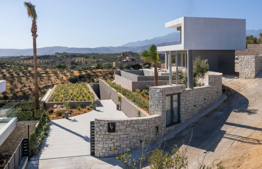 a building with a hill in the background