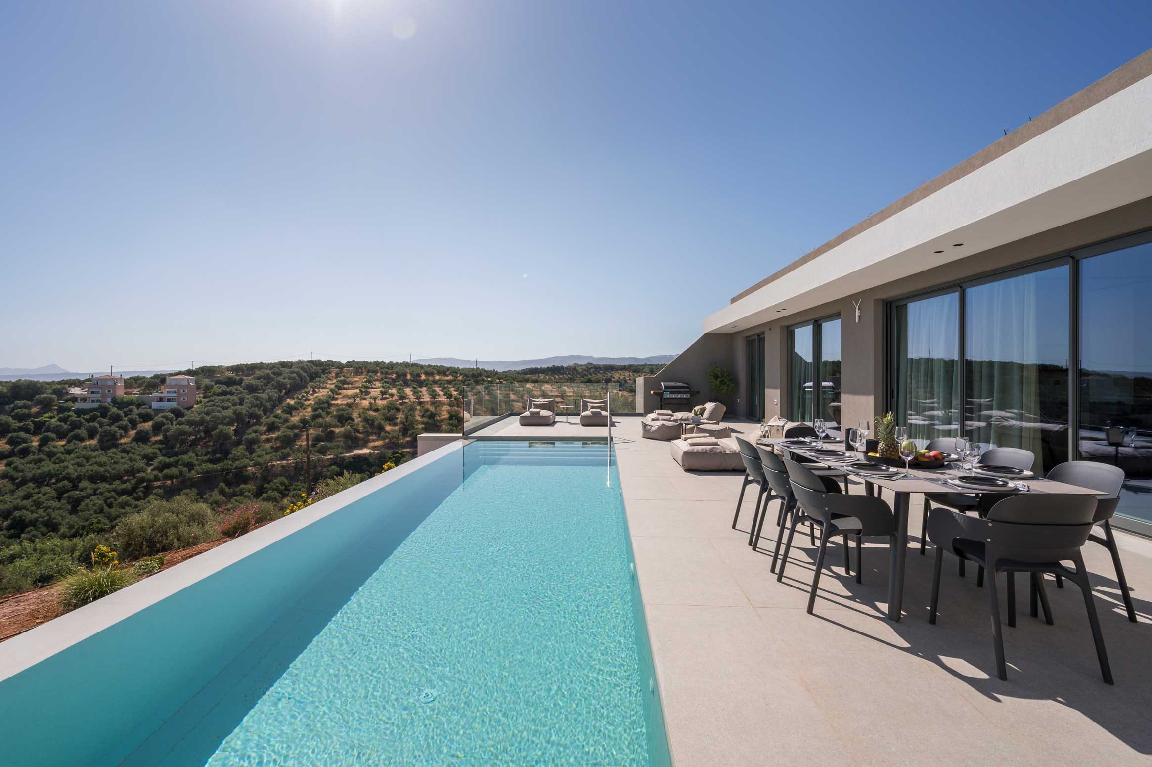 a pool and chairs on a deck